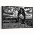 Black and white wall art featuring a series of architectural arches, printed on framed canvas, ideal for bedroom wall decor.