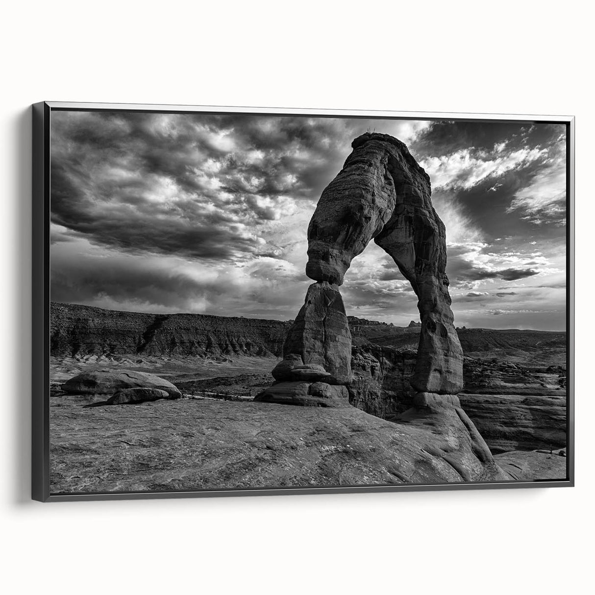 Black and white wall art featuring a series of architectural arches, printed on framed canvas, ideal for bedroom wall decor.