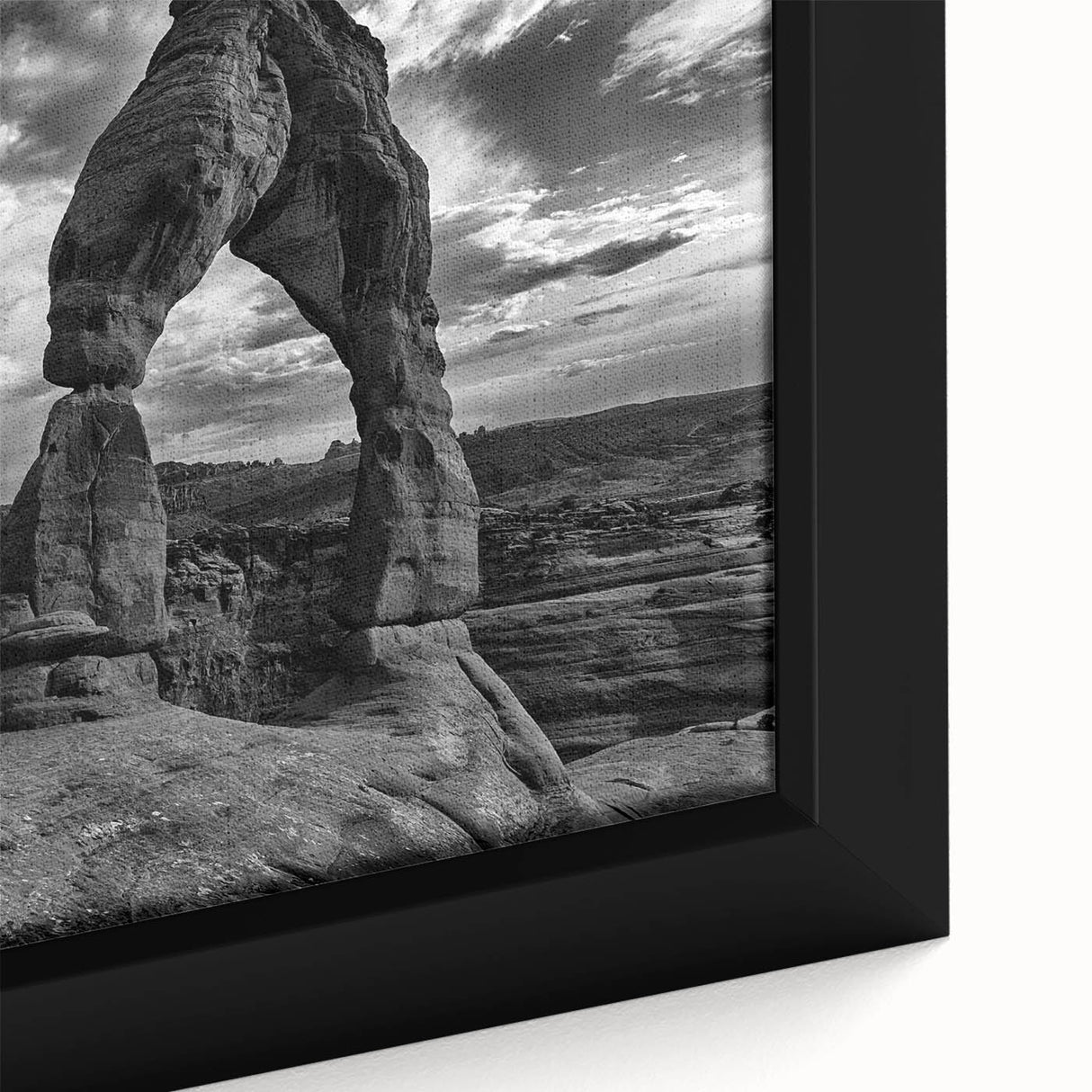 Close-up of a framed canvas featuring black wall art with colorful, textured arch designs, ideal for living room decor.