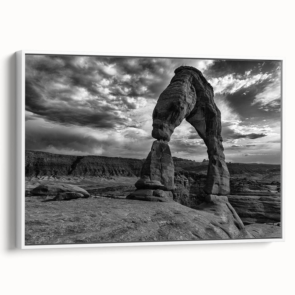 Framed canvas featuring a black and white vintage poster of architectural arches, ideal for bedroom wall decor.