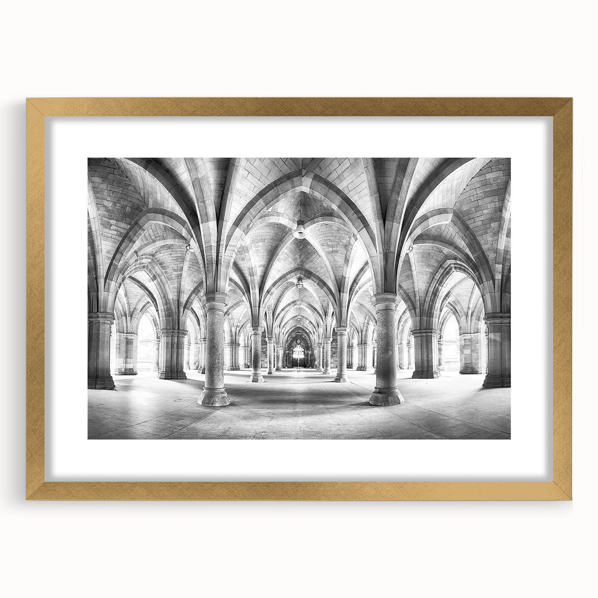 Abstract art print featuring geometric arch designs in gold and black, framed with a mat, ideal for dining room decor.