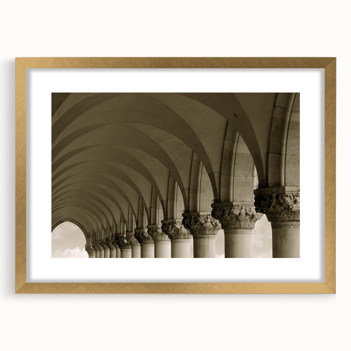 Abstract art print featuring interconnected arches in gold and black tones on a framed canvas.