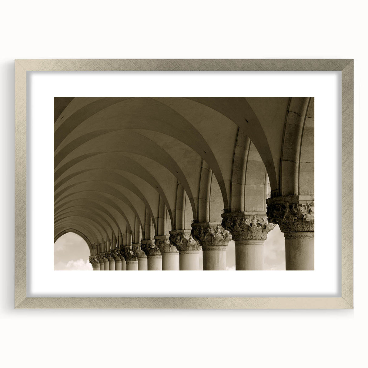 Textured art print of abstract arches in cool gray tones, framed in silver, ideal for bedroom wall decor.