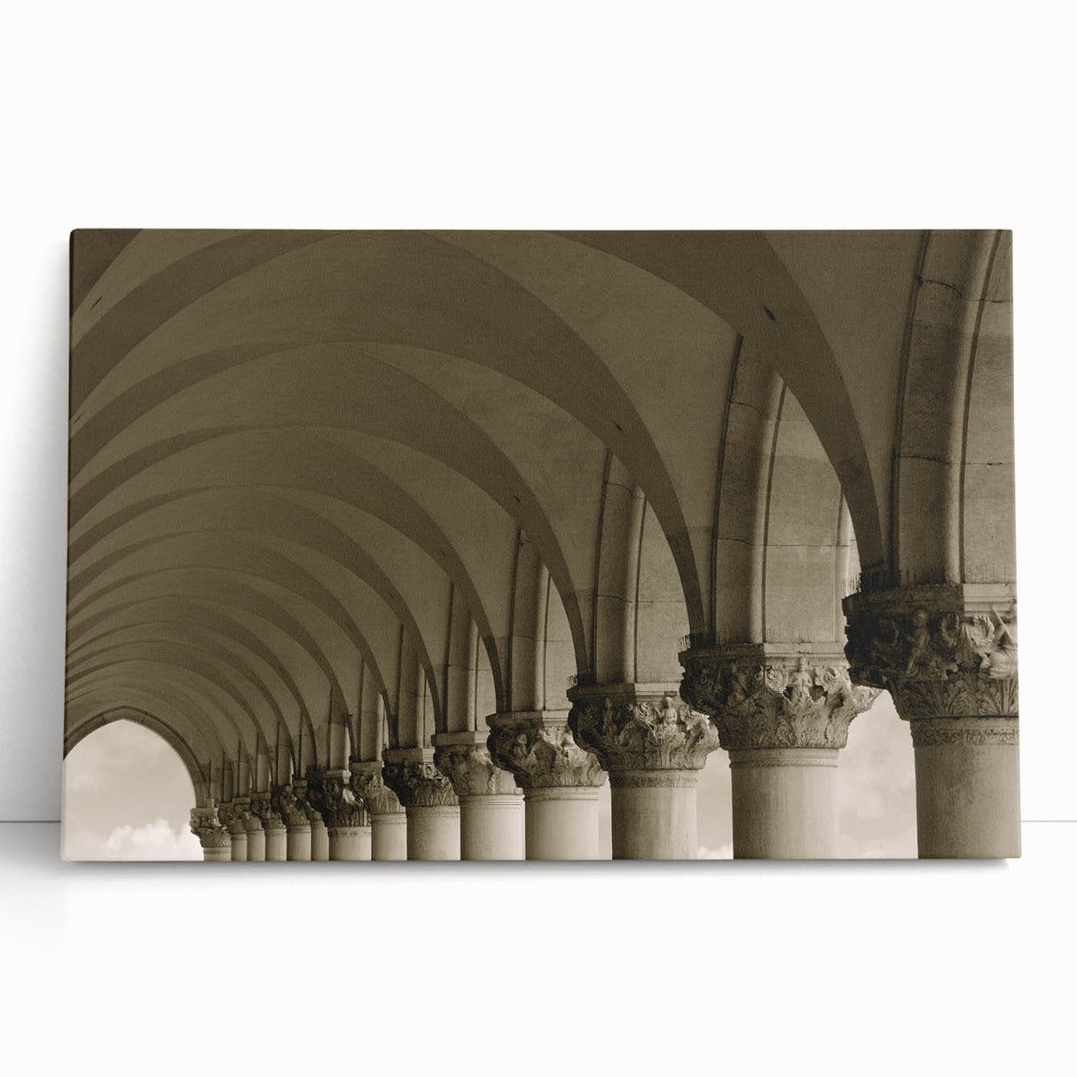 Black and white photo of architectural arches printed on large stretched canvas.