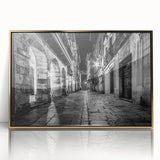 Mid-century modernist art depicting arches in gold and black tones on a framed acrylic, suitable for nursery wall decor.
