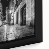 Close-up of a black wall art featuring colorful, textured arch designs on a large framed canvas.