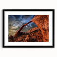 Extra large abstract art print featuring colorful, textured arches on a black framed canvas, ideal for living room decor.