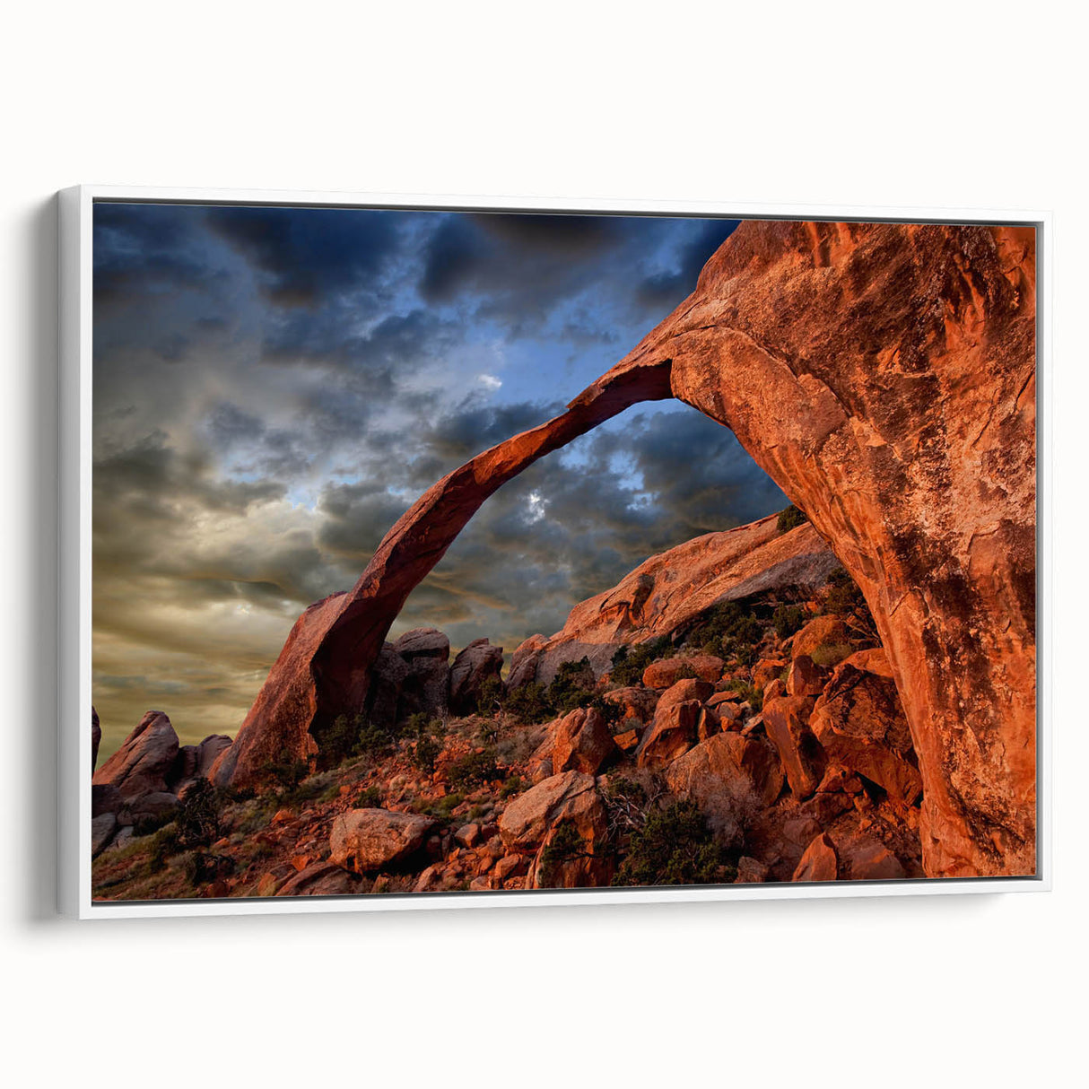 Framed canvas of a black and colorful vintage poster art depicting a landscape with arches, ideal for office decor.