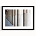 Extra large abstract art print featuring colorful, textured columns, framed in black, ideal for living room decor.