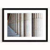 Extra large abstract art print featuring colorful, textured columns, framed in black, ideal for living room decor.