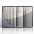 Large abstract wall art featuring black and white architectural columns in a mid-century modernist style.