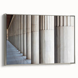 Framed canvas featuring a black and white vintage poster of architectural columns, ideal for office decor.