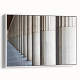 Vintage poster art of architectural columns in black and white on a framed canvas, suitable for living room decor.