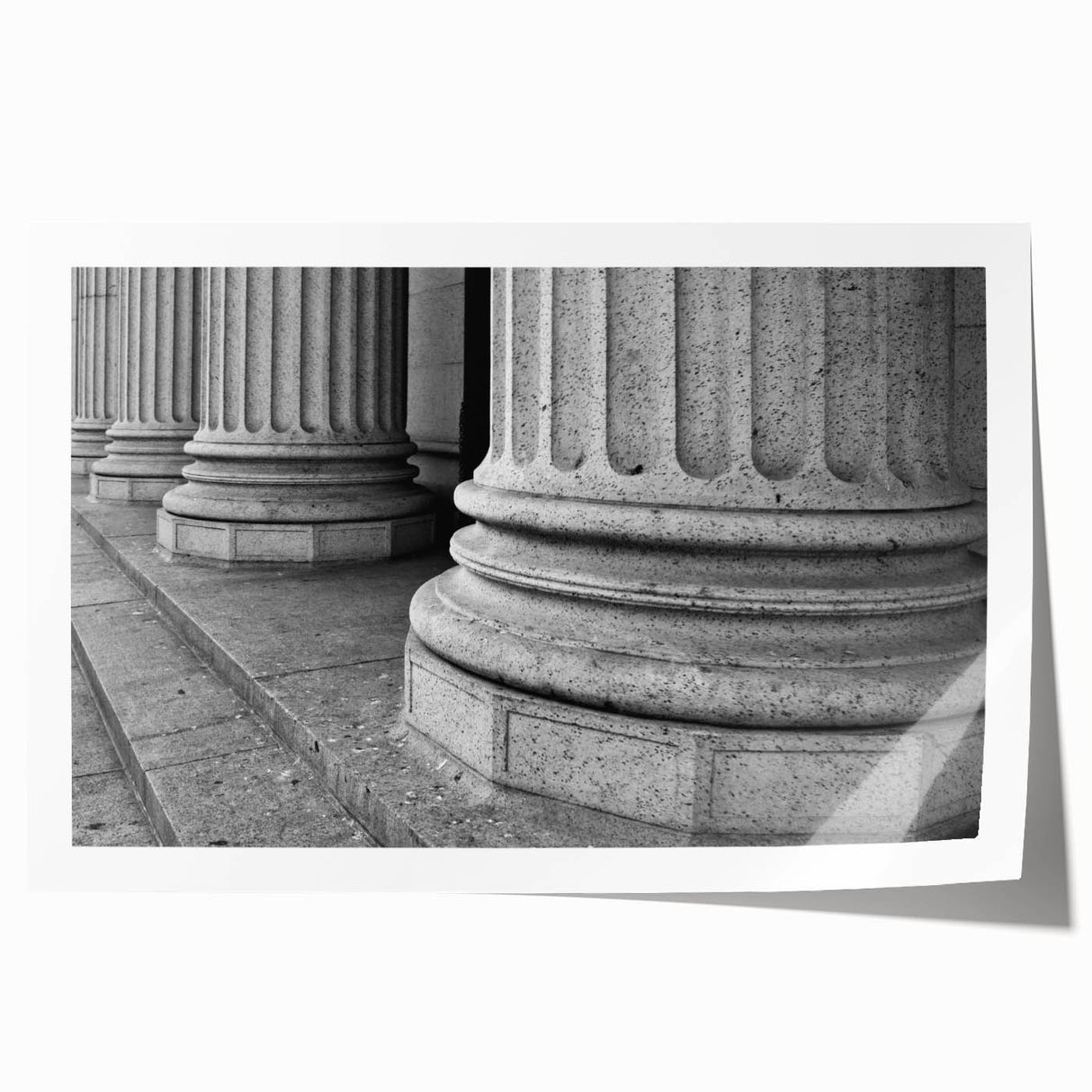 Rolled print featuring a detailed illustration of neoclassical architecture columns in muted gray tones.