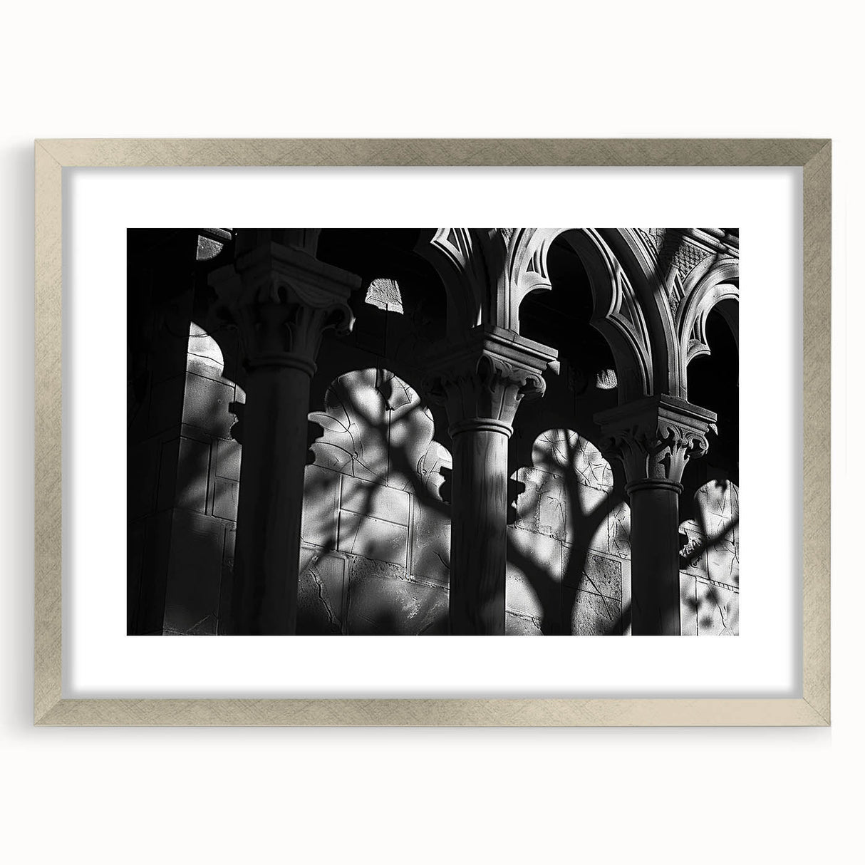 Textured art print featuring abstract columns in gray tones on a framed silver mat, ideal for bedroom decor.