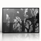 Large abstract wall art featuring black and white architectural columns in a mid-century modernist style.