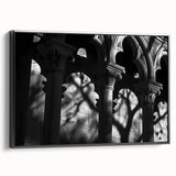 Black and white framed canvas featuring vintage poster art of architectural columns, ideal for bedroom decor.