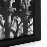 Close-up of black wall art featuring colorful, textured columns design on a large framed canvas, ideal for living room decor.