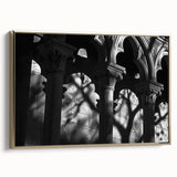 Framed canvas of vintage poster art featuring black architectural columns in a landscape format.