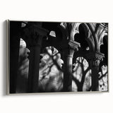 Framed canvas featuring a grayscale vintage poster of architectural columns.