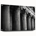 Side view of large abstract wall art featuring architectural columns in muted gray tones on acrylic glass.