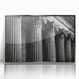 Mid-century modernist art featuring silver framed acrylic print of architectural columns in muted gray tones.