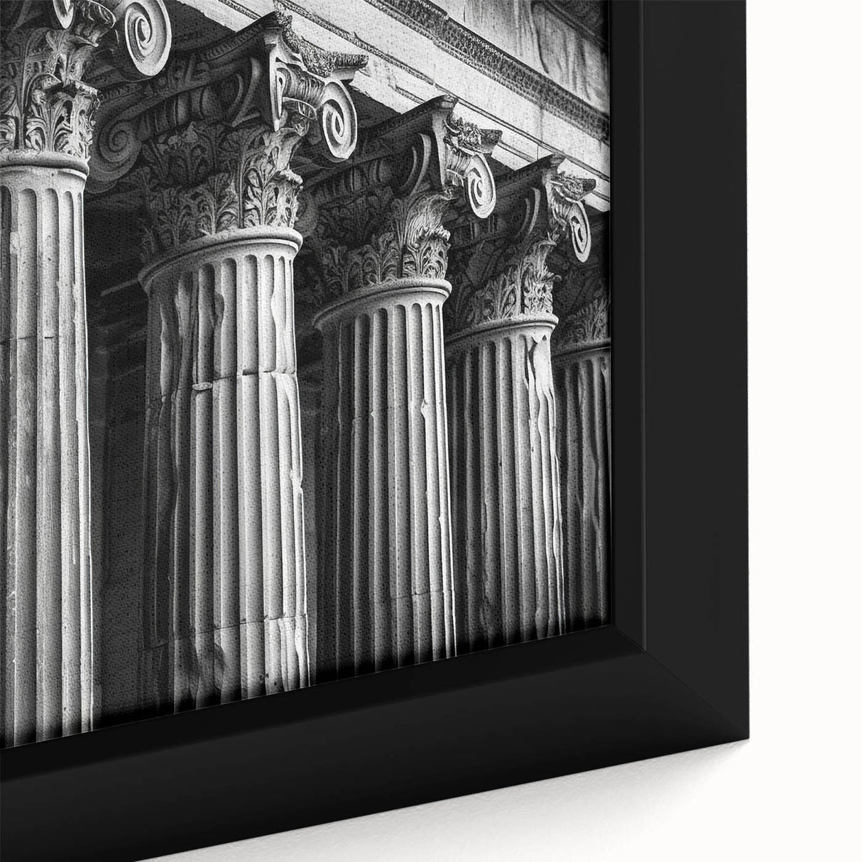 Close-up of black wall art featuring textured, colorful abstract design on framed canvas, ideal for living room decor.