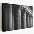 Large art print on stretched canvas depicting classical architecture columns in muted beige tones.