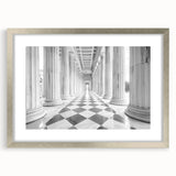 Textured art print featuring abstract columns in muted gray tones, displayed in a silver frame, ideal for bedroom ambiance.