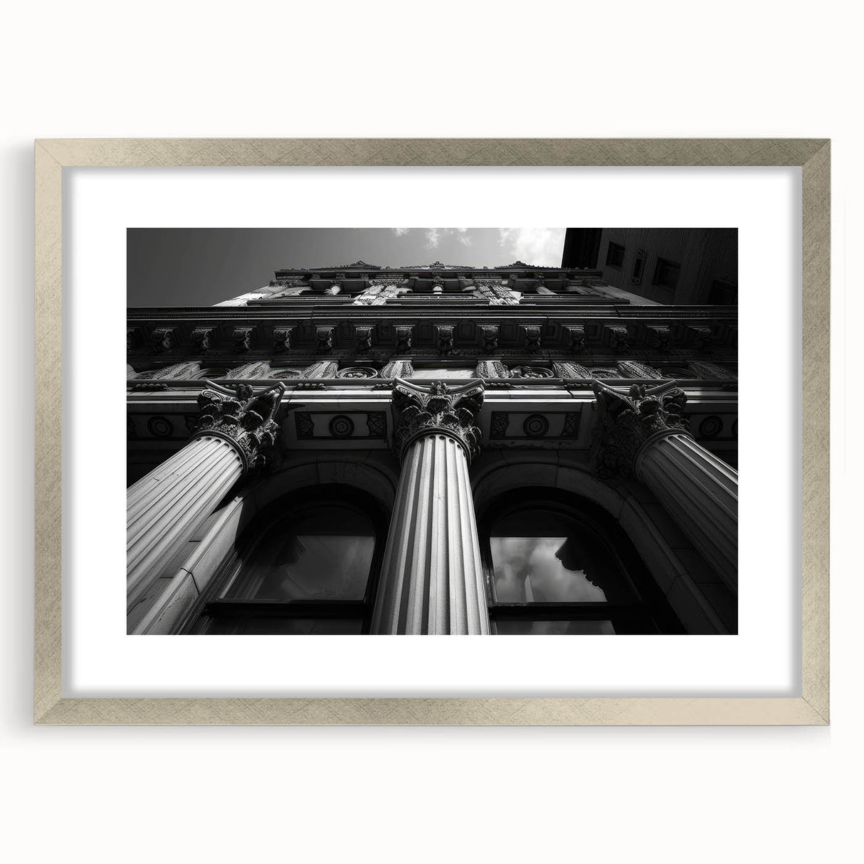 Textured art print featuring abstract columns in muted gray, ideal for modern bedroom decor, framed with a silver mat.