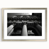 Textured art print featuring abstract columns in muted gray, ideal for modern bedroom decor, framed with a silver mat.