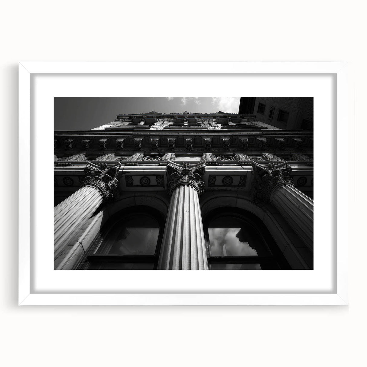 Abstract art print of architectural columns in muted gray, framed in white, ideal for dining room or bedroom decor.