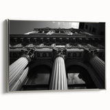 Framed canvas featuring a vintage poster of colorful landscape art with black architectural columns, ideal for office decor.