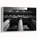 Vintage poster art of classical columns in black and white on a framed canvas, suitable for living room decor.