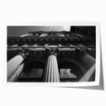 Extra large rolled print of a classical architecture design with detailed columns in muted earth tones.