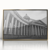 Large art print of a mid-century modernist column design in gold and white tones on a framed acrylic.