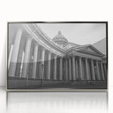Mid-century modernist art featuring silver-framed acrylic print of architectural columns in monochrome tones.