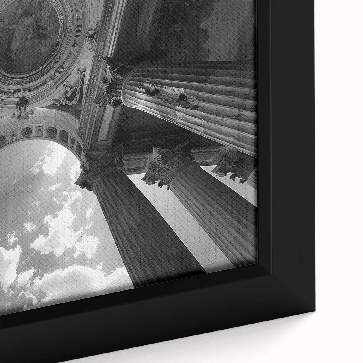 Close-up of a black framed canvas featuring a textured design of colorful, abstract columns, ideal for living room decor.