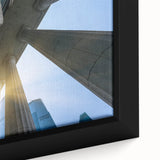 Close-up of a black wall art featuring textured columns in vibrant colors on framed canvas, ideal for living room decor.