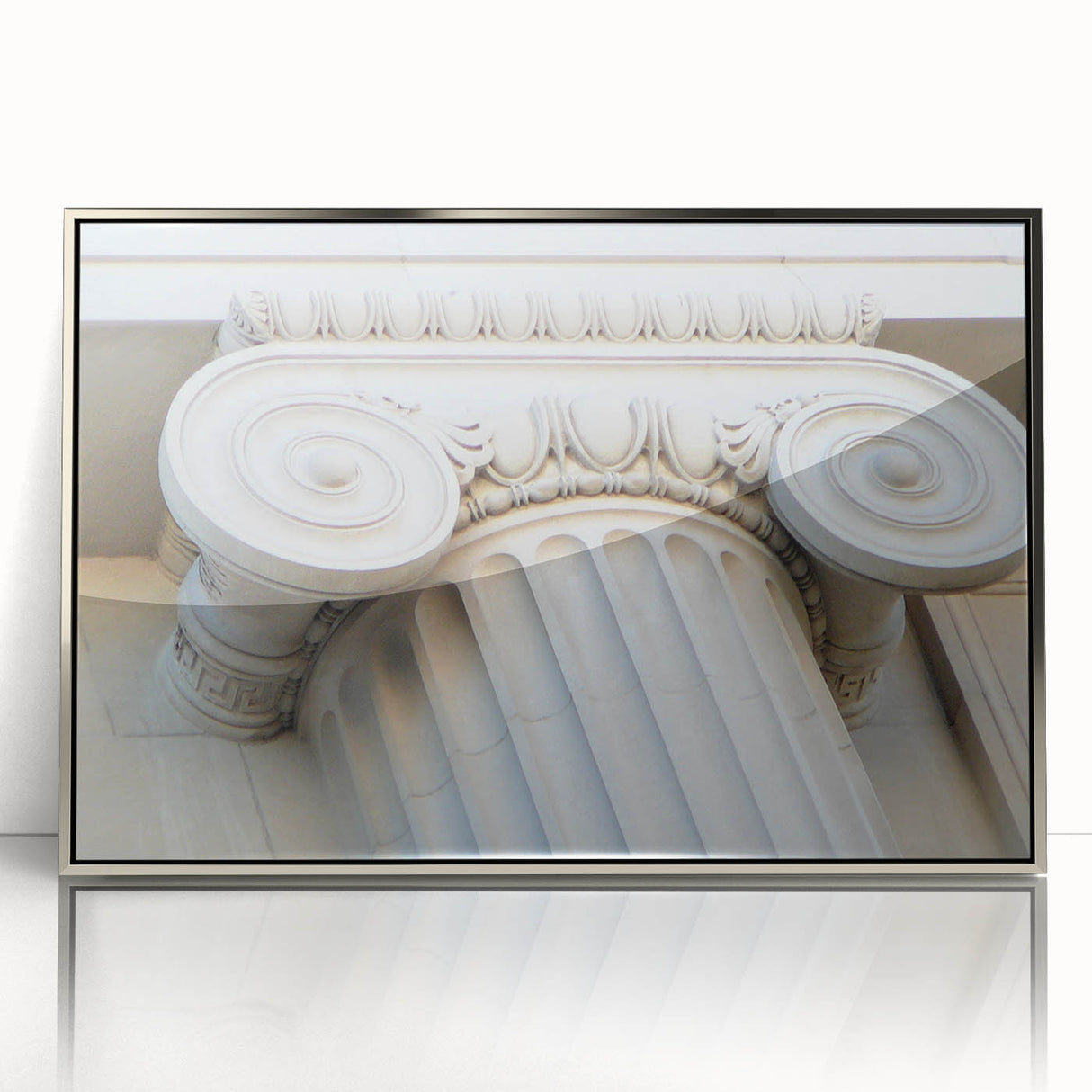 Mid-century modernist art featuring silver-framed acrylic print of architectural columns in muted tones.