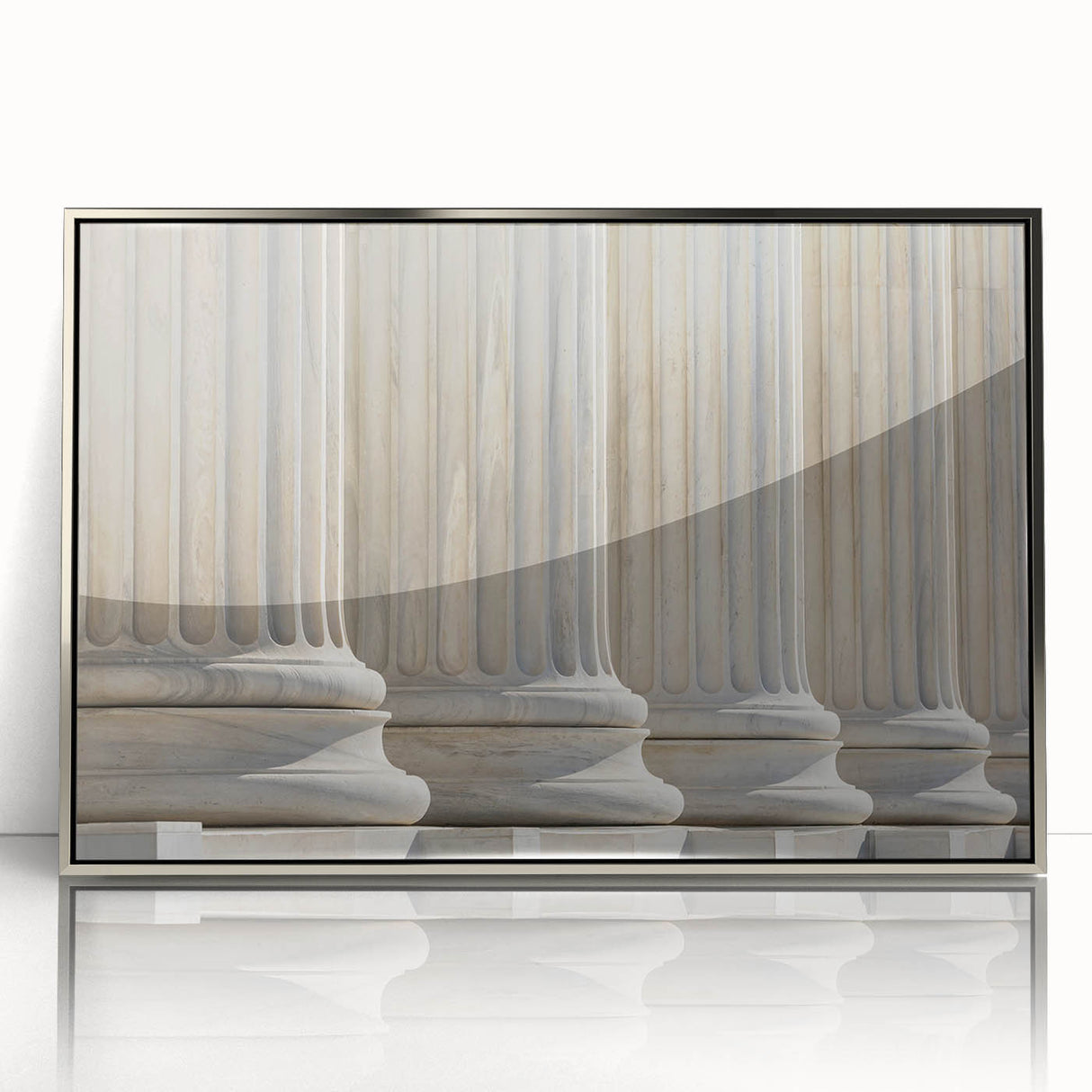 Mid-century modernist art featuring silver-framed acrylic print of architectural columns in muted tones.