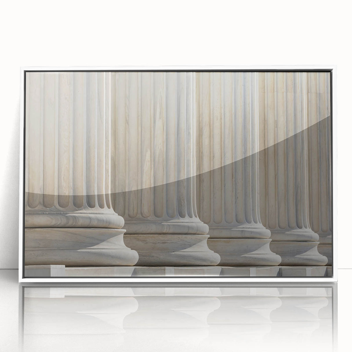 Art deco poster featuring symmetrical columns in muted white and gray tones on a framed acrylic.