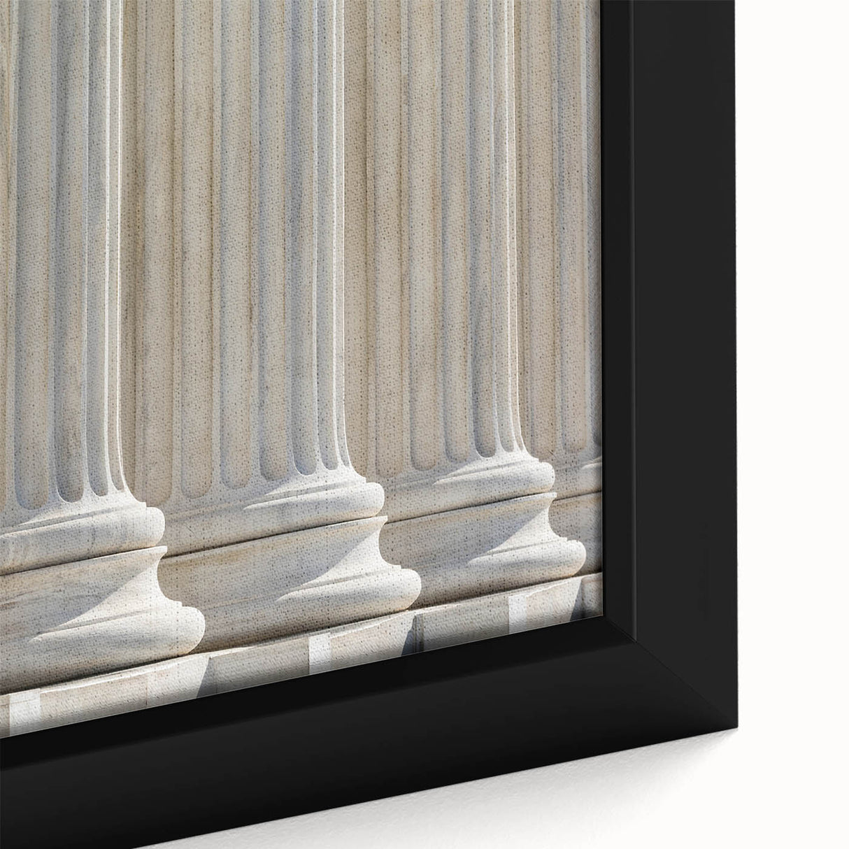Close-up of a black framed canvas featuring a textured column design in vibrant colors, ideal for living room decor.