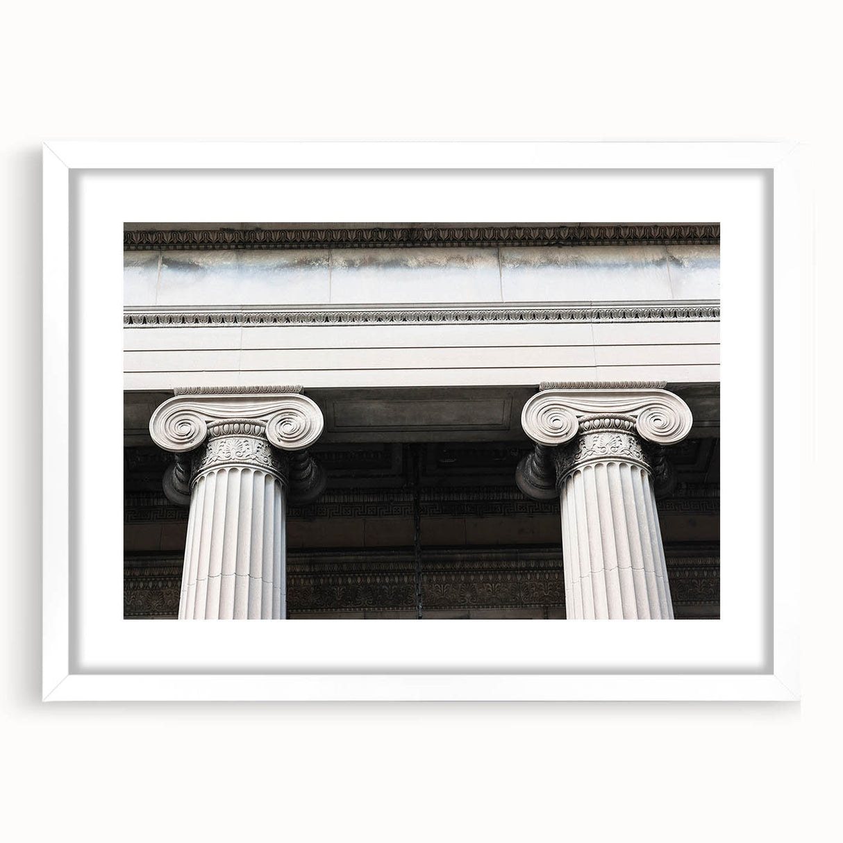 Abstract art print featuring a series of vertical columns in muted gray and white, framed in white.
