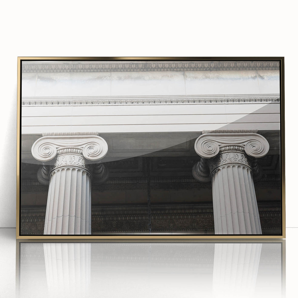 Large art print of architectural columns in gold tones on acrylic, framed, in mid-century modernist style.