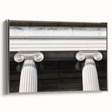 Framed canvas of a vintage poster featuring a black and colorful landscape with architectural columns.