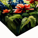 Large art depicting a serene landscape with cottages, in black and white tones on stretched canvas.