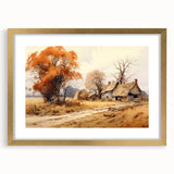 Abstract art print of cottages in muted gold and white, framed in gold, suitable for dining room or bedroom decor.