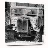 Large abstract wall art on acrylic, featuring a derelict building in muted grays and blues.