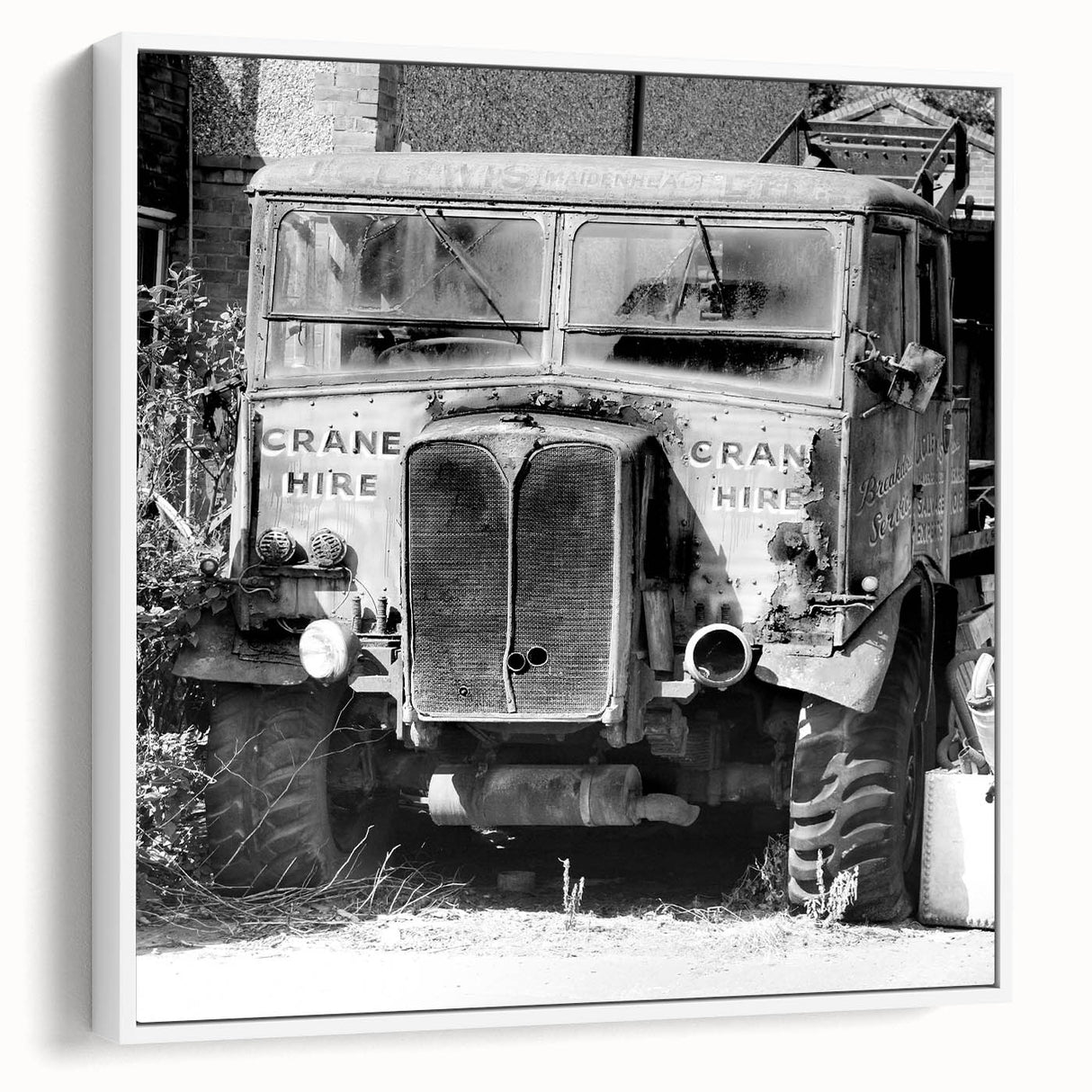Vintage poster art of a derelict building on a framed canvas, featuring muted colors, ideal for living room decor.
